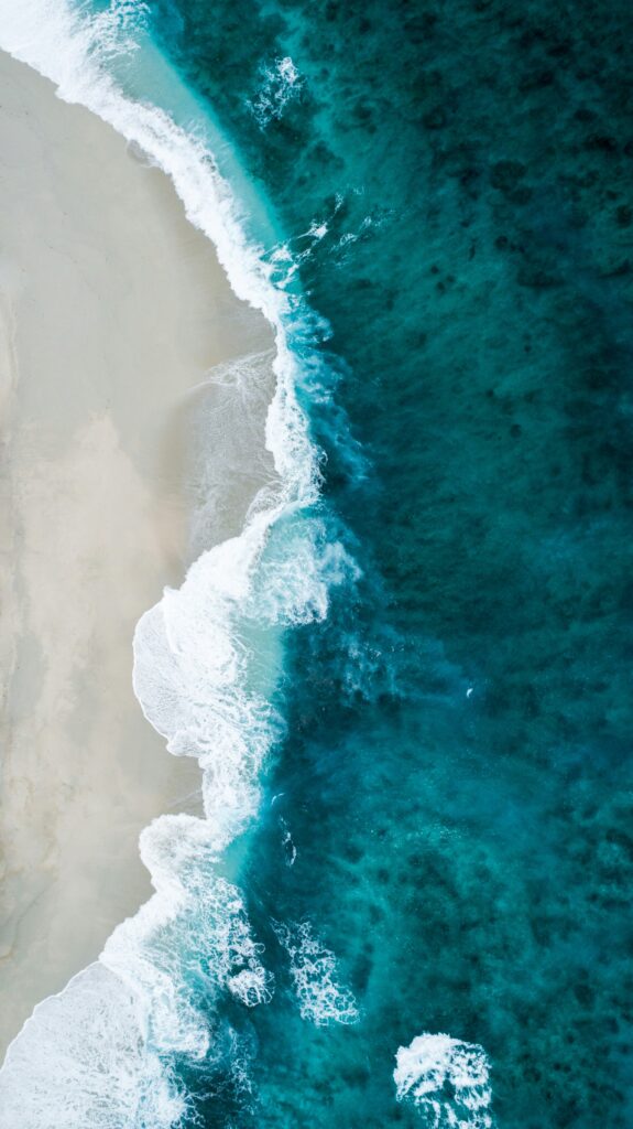 blue ocean from above - shoreline with breach and waves - Birte Rommeswinkel - Pic-by-shifaaz-shamoon-sLAk1guBG90-unsplash-scaled